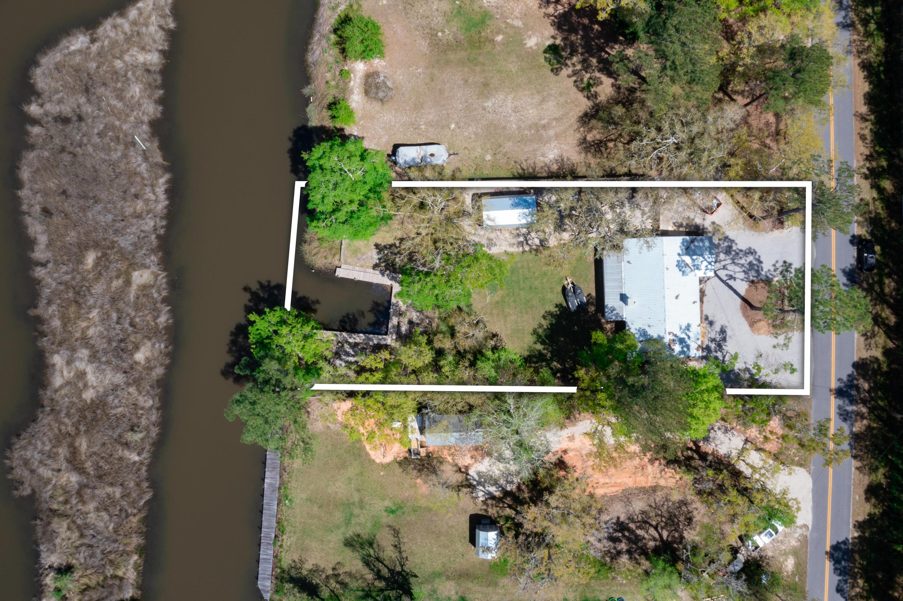 1534 Bay Grove Road Freeport, FL 32439 - Photo 3 of 33 an aerial view of a house with a yard