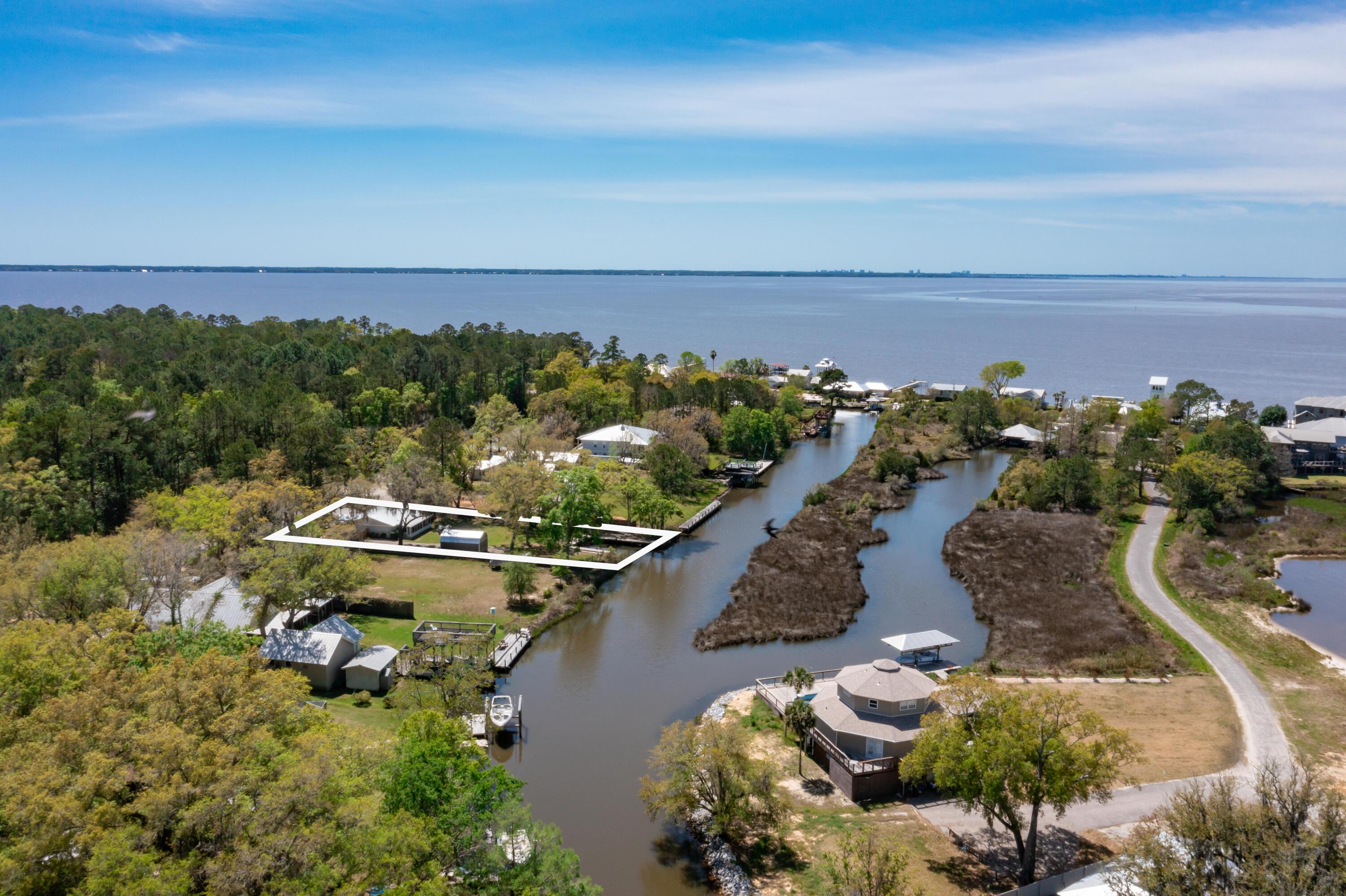1534 Bay Grove Road Freeport, FL 32439 - Photo 31 of 33 a view of a lake with a mountain