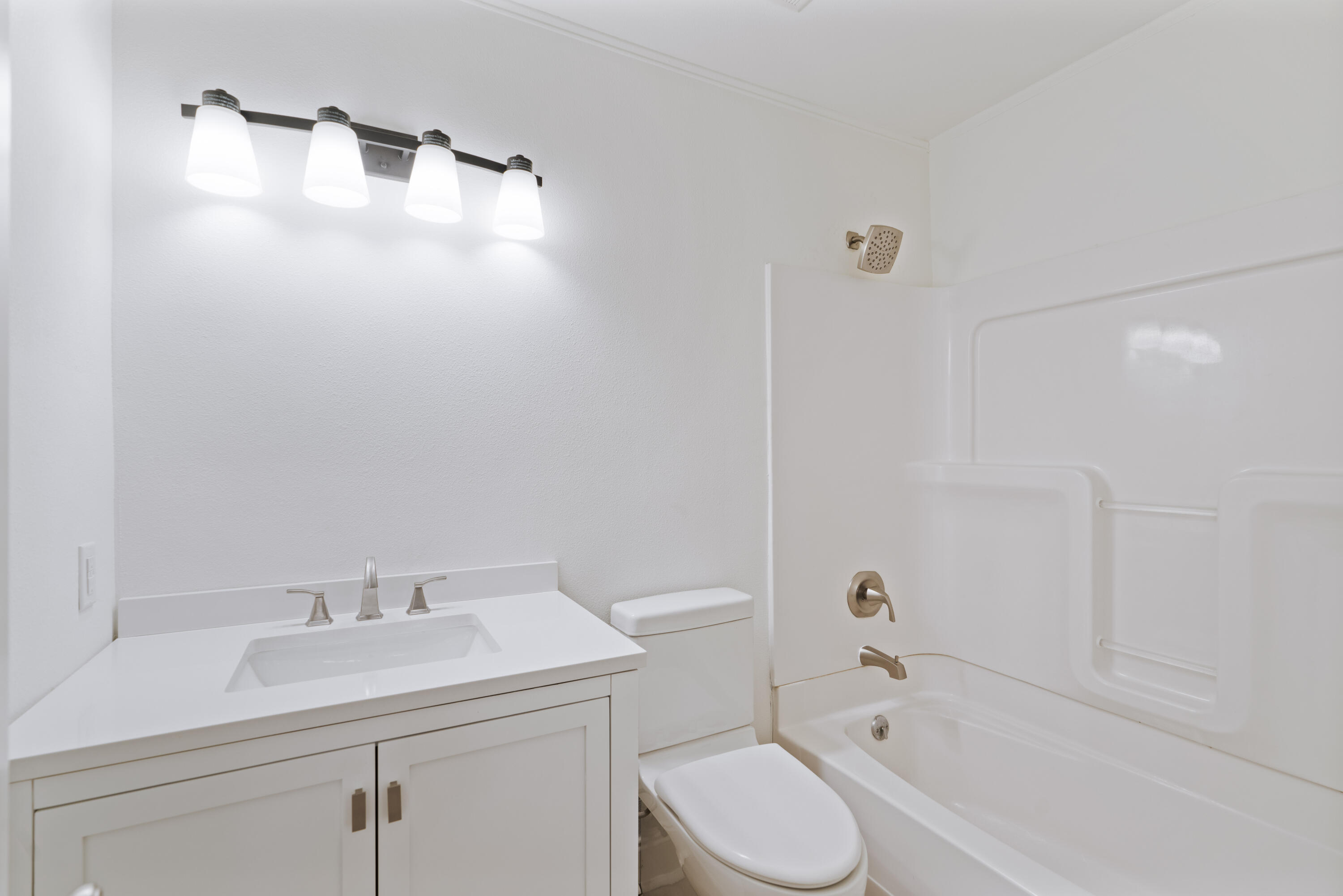 1534 Bay Grove Road Freeport, FL 32439 - Photo 8 of 33 a bathroom with a sink a toilet and shower