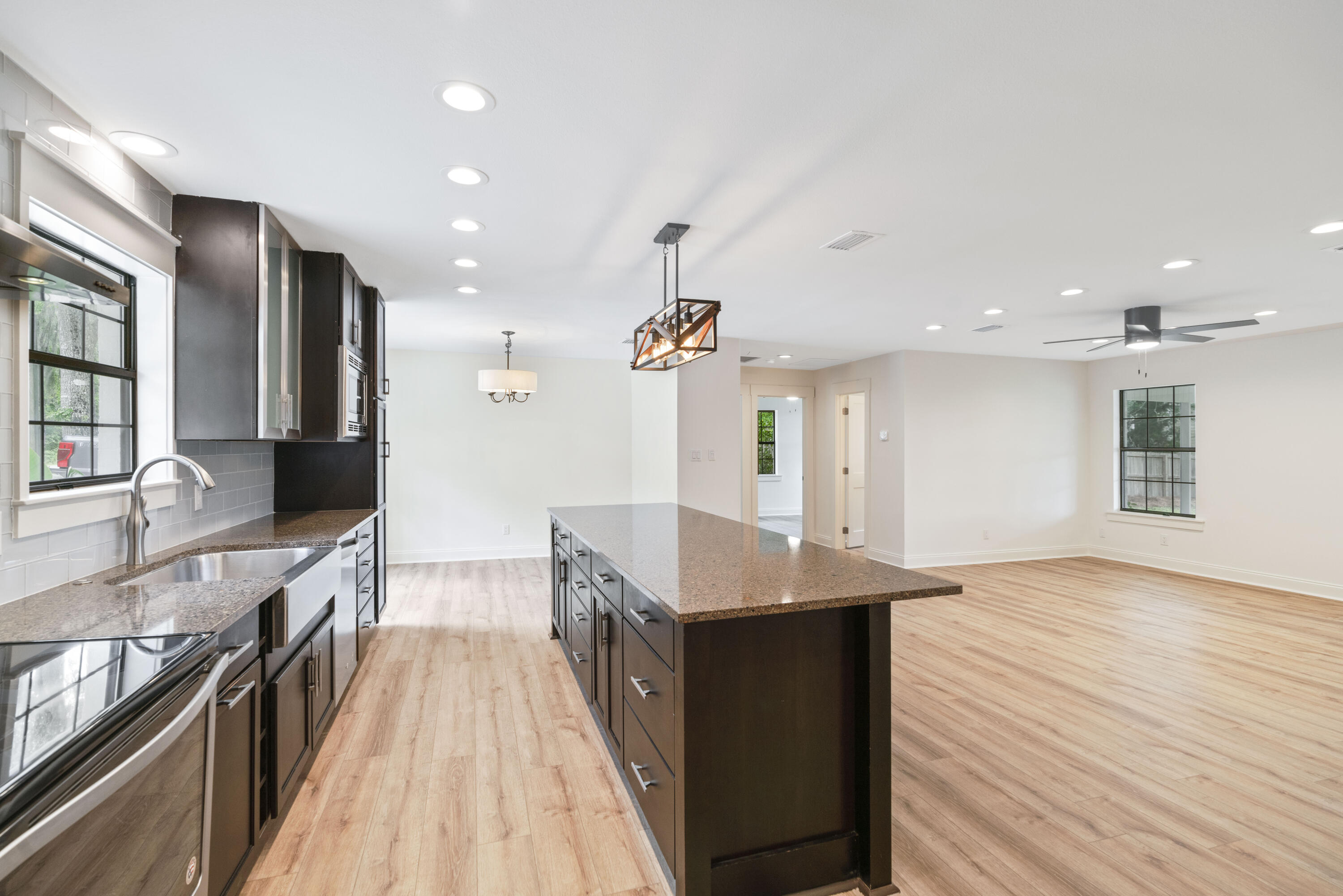 1534 Bay Grove Road Freeport, FL 32439 - Photo 10 of 33 a kitchen with stainless steel appliances granite countertop a kitchen island a stove and a sink