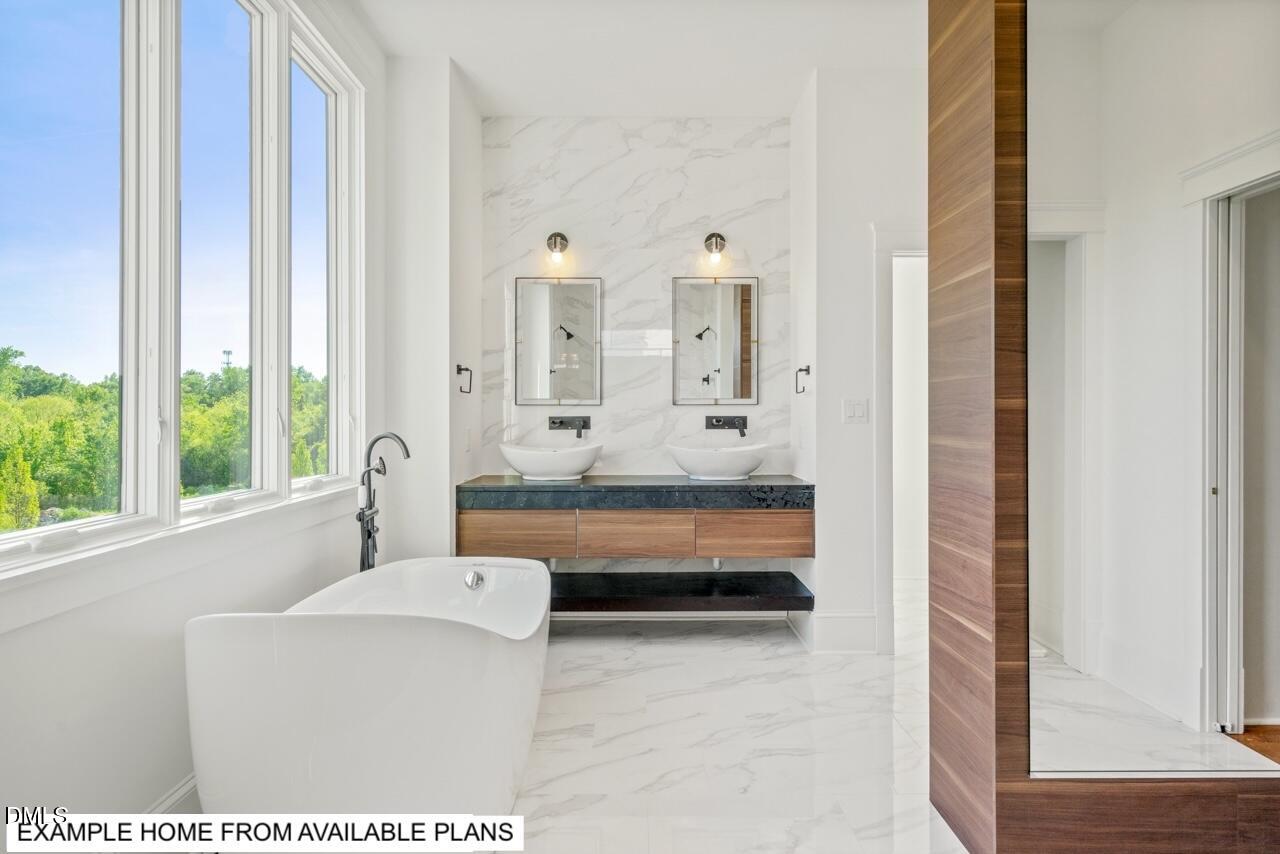 623 Velma Hopkins Lane Raleigh, NC 27603 - Photo 9 of 13 a bathroom with bathtub and shower