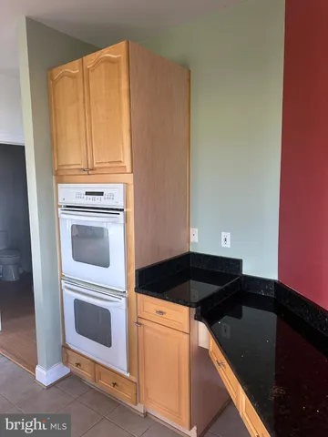 a view of empty room with a fireplace