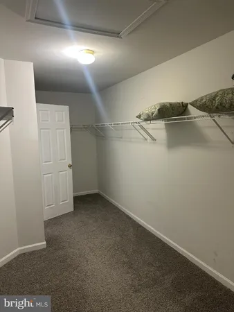 a view of gallery with wooden floor