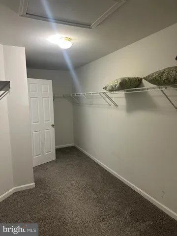 a view of gallery with wooden floor