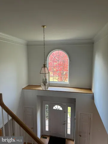a view of an empty room and a window