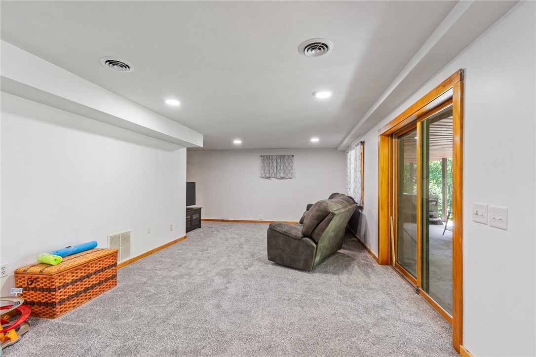 7733 East Port Bay Road Wolcott, NY 14590 - Photo 30 of 49 The lower level finished space has plenty of storage and newer recessed lighting - walk out to the patio area too!