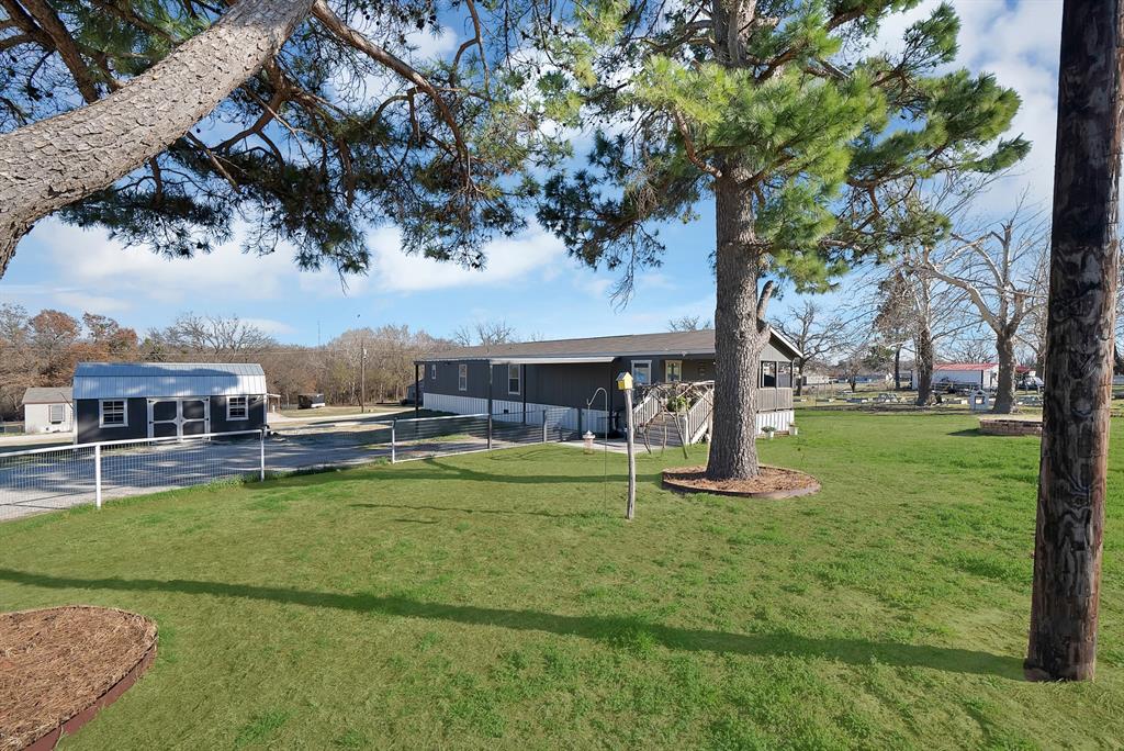 a swimming pool with outdoor seating and yard