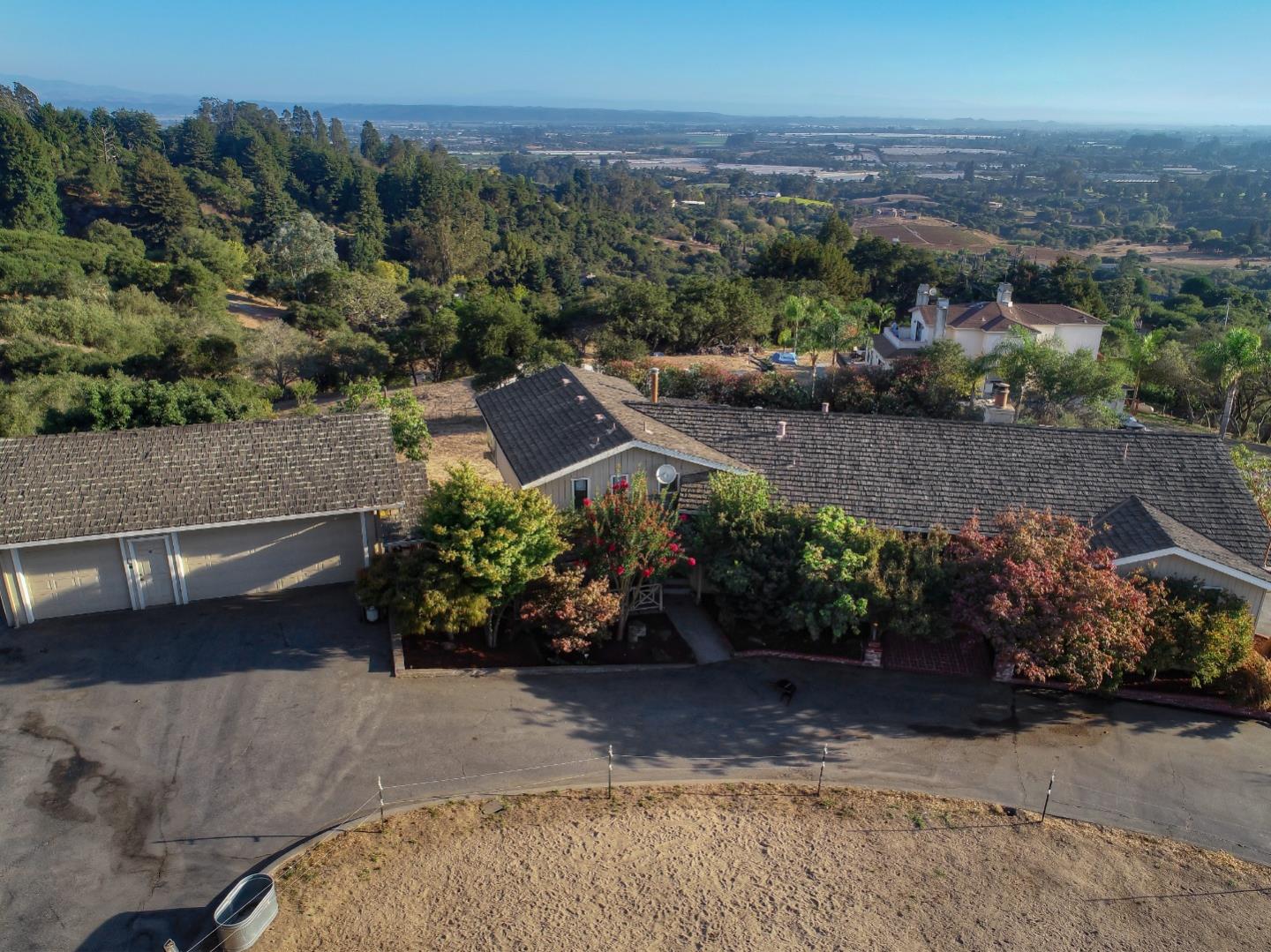 990 Smith Road Watsonville, CA 95076 - Photo 48 of 63 a view of a garden with a lot of flower plants and wooden fence