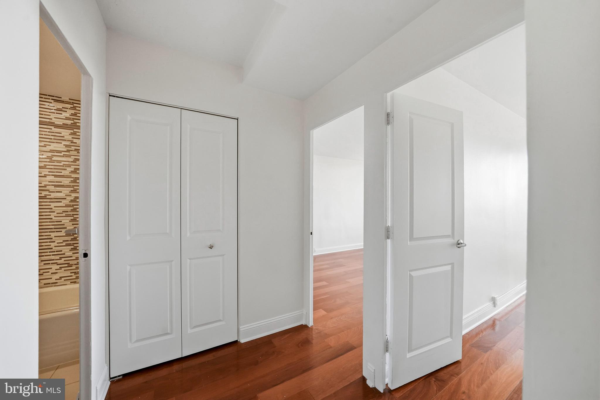 210 Locust Street, Unit 7BW Philadelphia, PA 19106 - Photo 28 of 34 a view of a hallway with wooden floor
