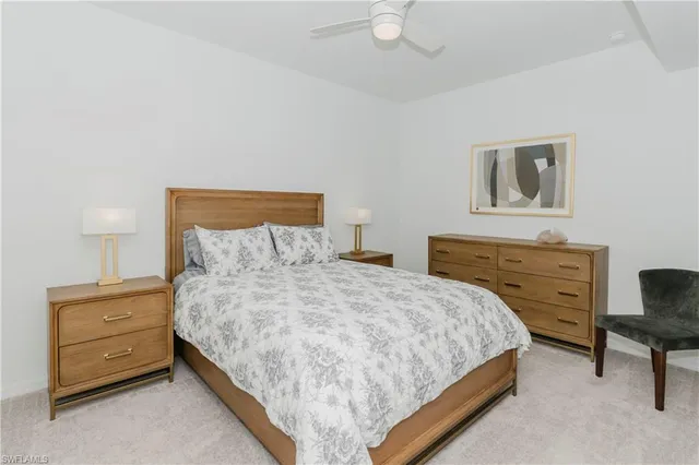 a bedroom with a bed and a chair