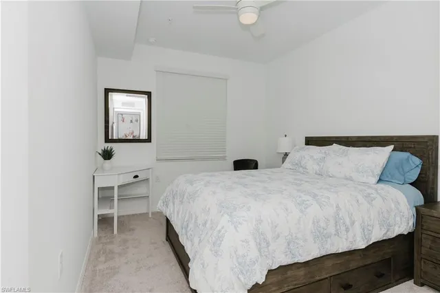 a bedroom with bed and a window