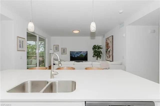 a bathroom with a sink and a large mirror