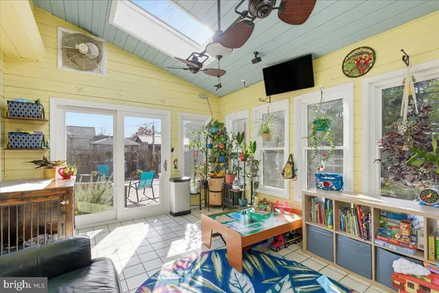 a bathroom with a granite countertop double vanity sink a mirror and a toilet
