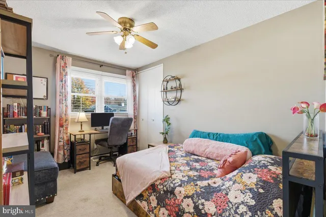 a bedroom with furniture and a book shelf