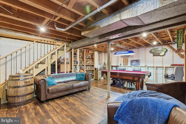 a room with furniture and pool table