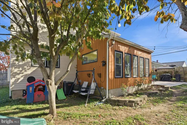 a view of a patio with couches chairs and a fire pit