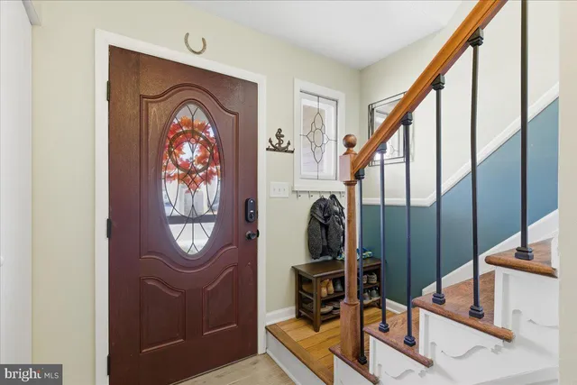 a view of front door with washer and dryer
