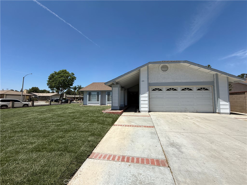 1251 Turley Street Riverside, CA 92501 - Photo 1 of 1 a front view of a house with a yard