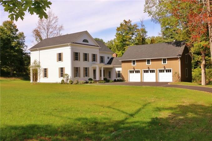 227 Bennetts Farm Road Ridgefield, CT 06877 - Photo 1 of 1 a front view of house with yard and trees in the background