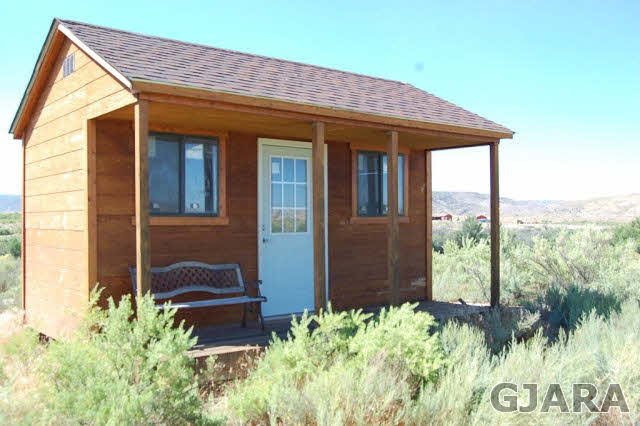 1645 9 Road Mack, CO 81525 - Photo 4 of 4 a front view of a house with garden
