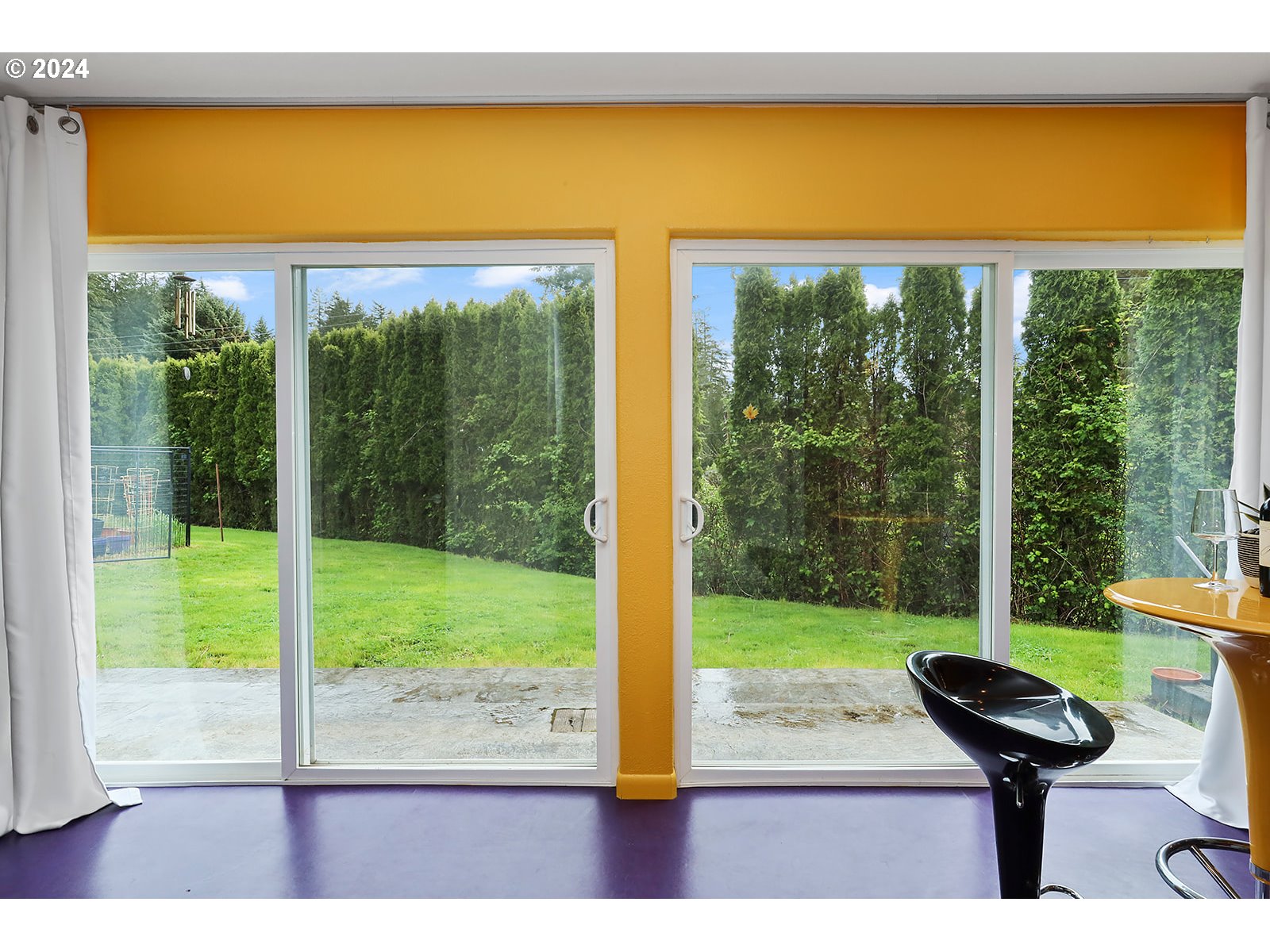 6972 East Loop Road Stevenson, WA 98648 - Photo 7 of 48 a view of a room with a large window and a yard