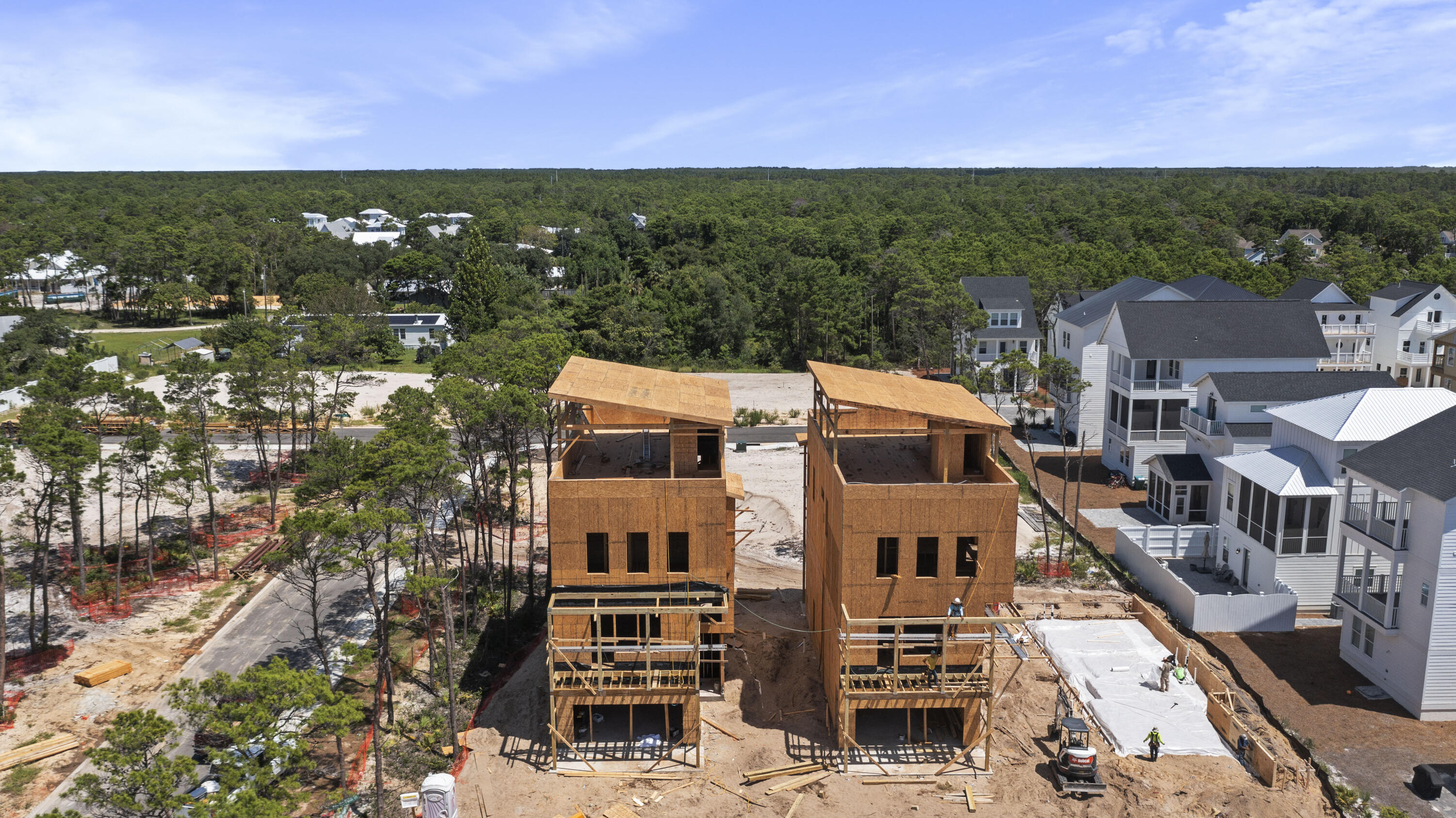 13063 Highway 98, Unit LOT 5 Inlet Beach, FL 32461 - Photo 9 of 14 a view of a city with a building in the background