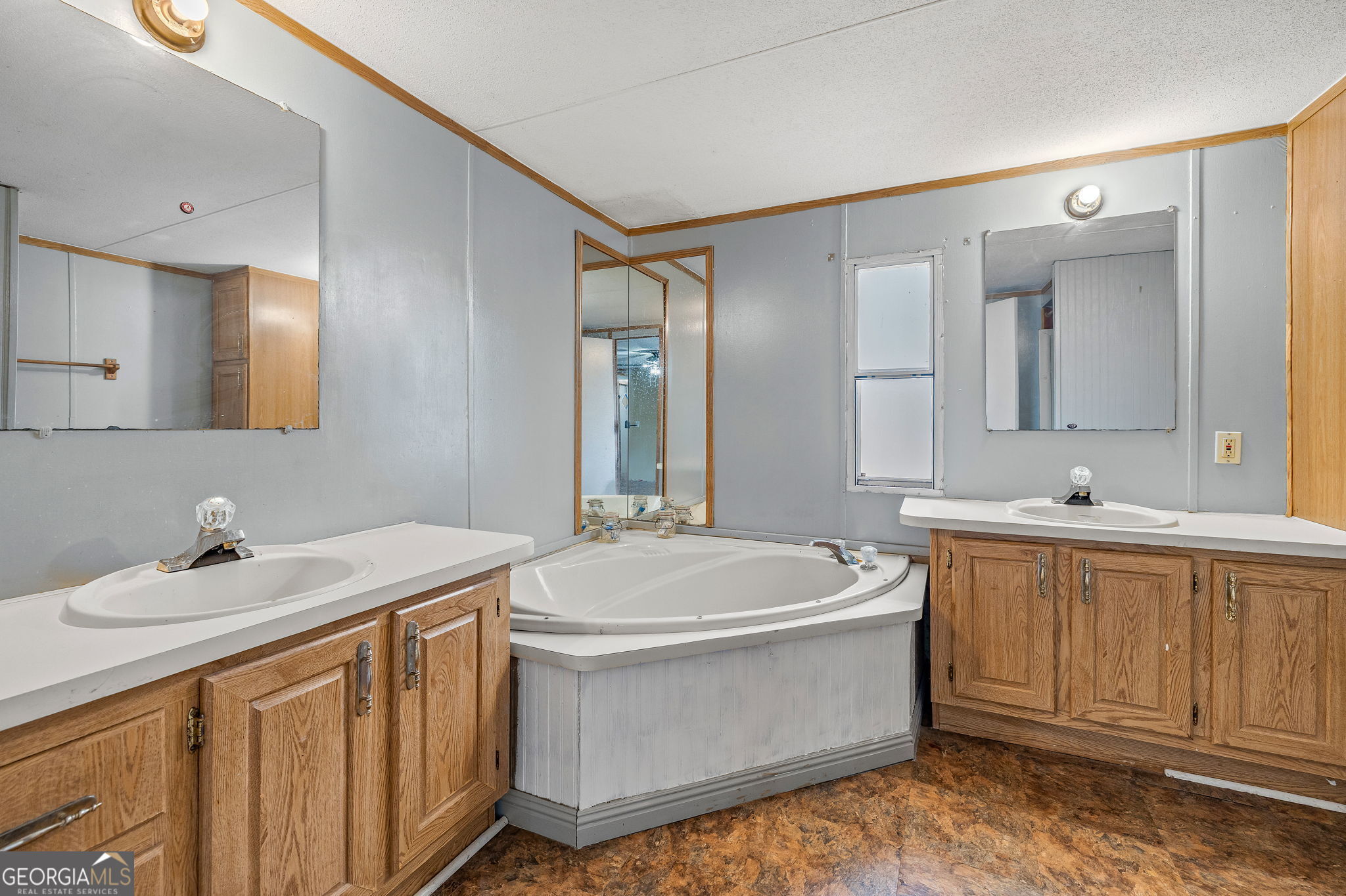 401 Otis Brown Road Baldwin, GA 30511 - Photo 11 of 23 a bathroom with a sink and a mirror