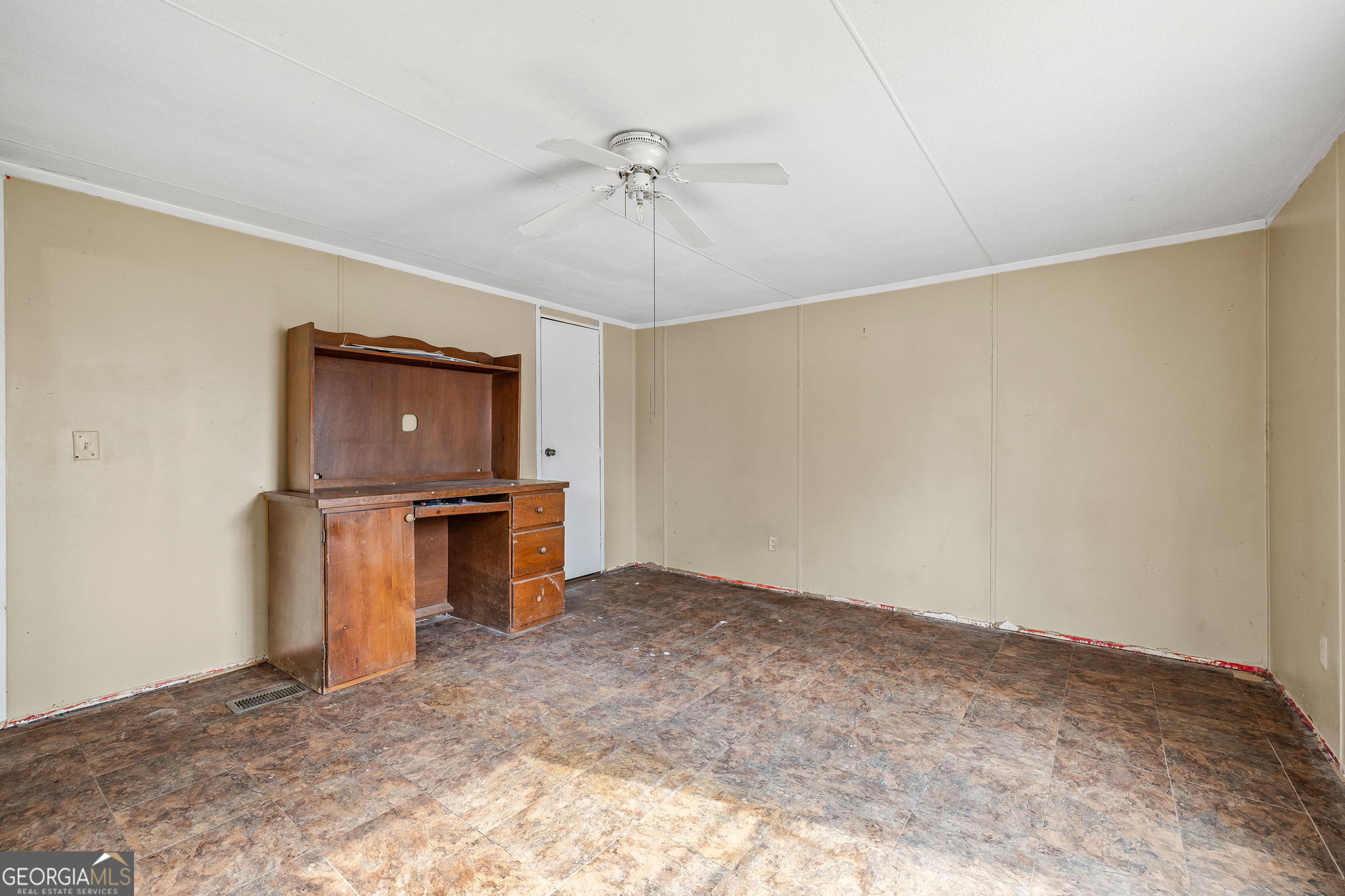 401 Otis Brown Road Baldwin, GA 30511 - Photo 15 of 23 a view of a room with a ceiling fan and hardwood floor