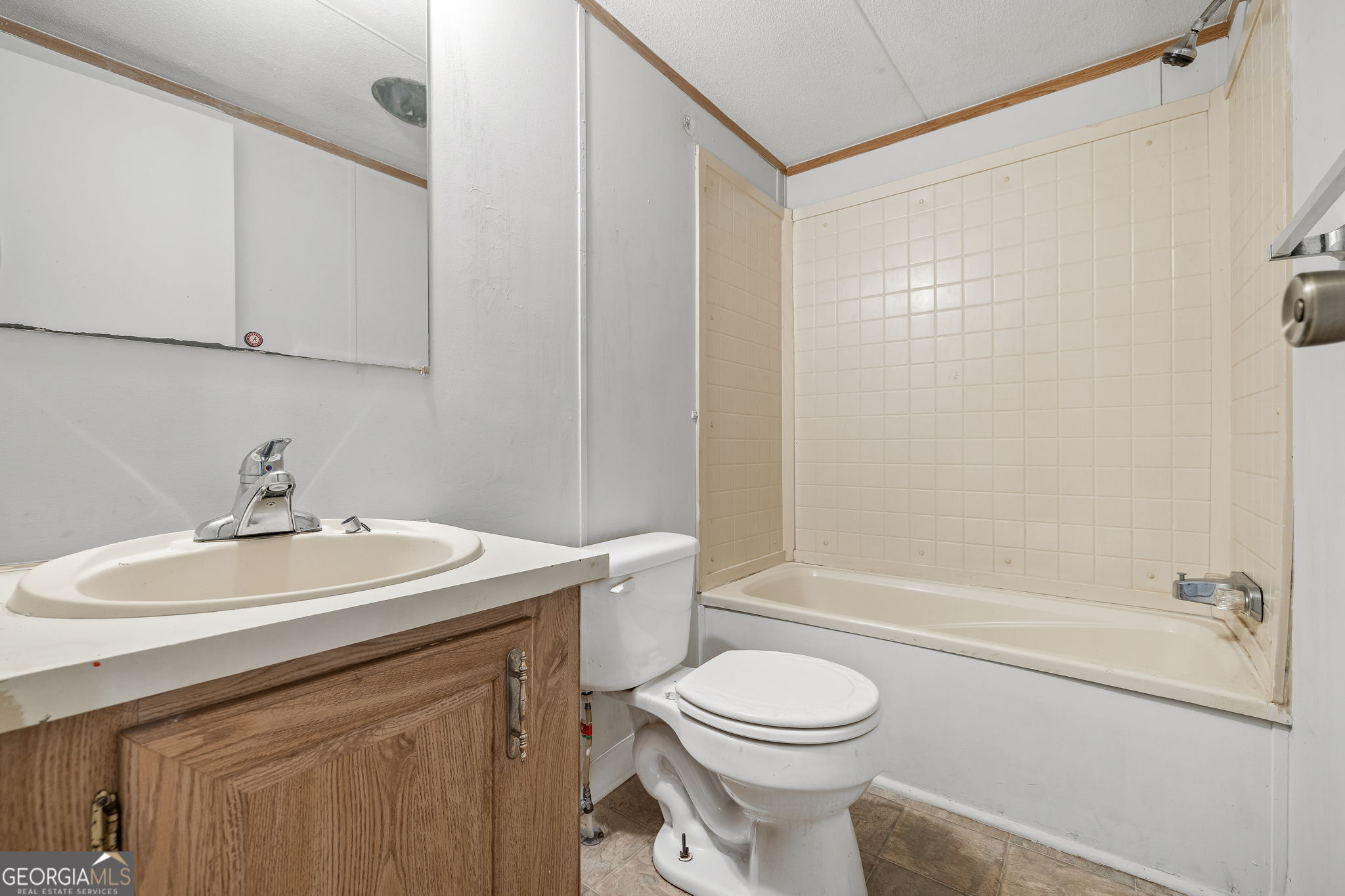 401 Otis Brown Road Baldwin, GA 30511 - Photo 17 of 23 a bathroom with a sink a toilet and shower
