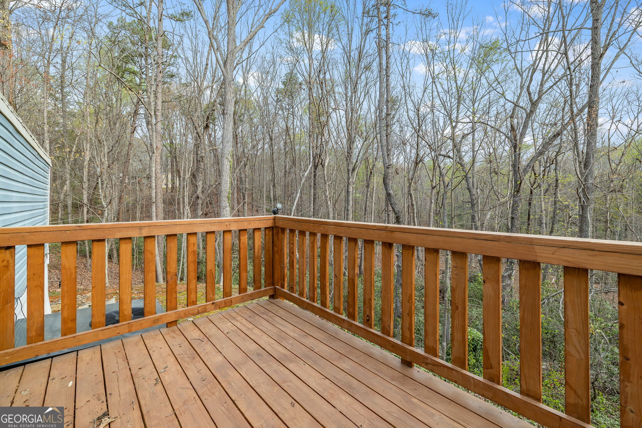 401 Otis Brown Road Baldwin, GA 30511 - Photo 19 of 23 a balcony with wooden floor and trees