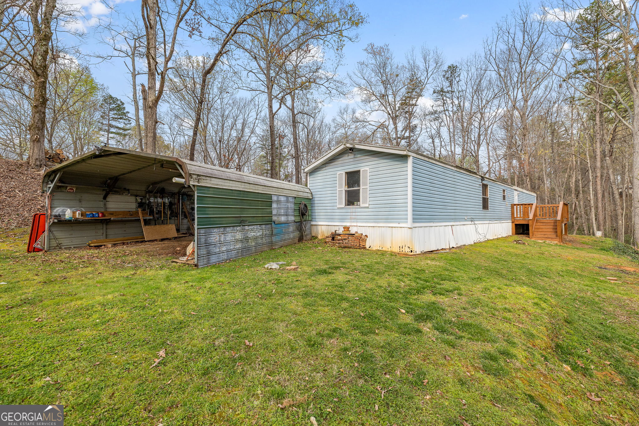 401 Otis Brown Road Baldwin, GA 30511 - Photo 22 of 23 a view of backyard of house with wooden fence and trees