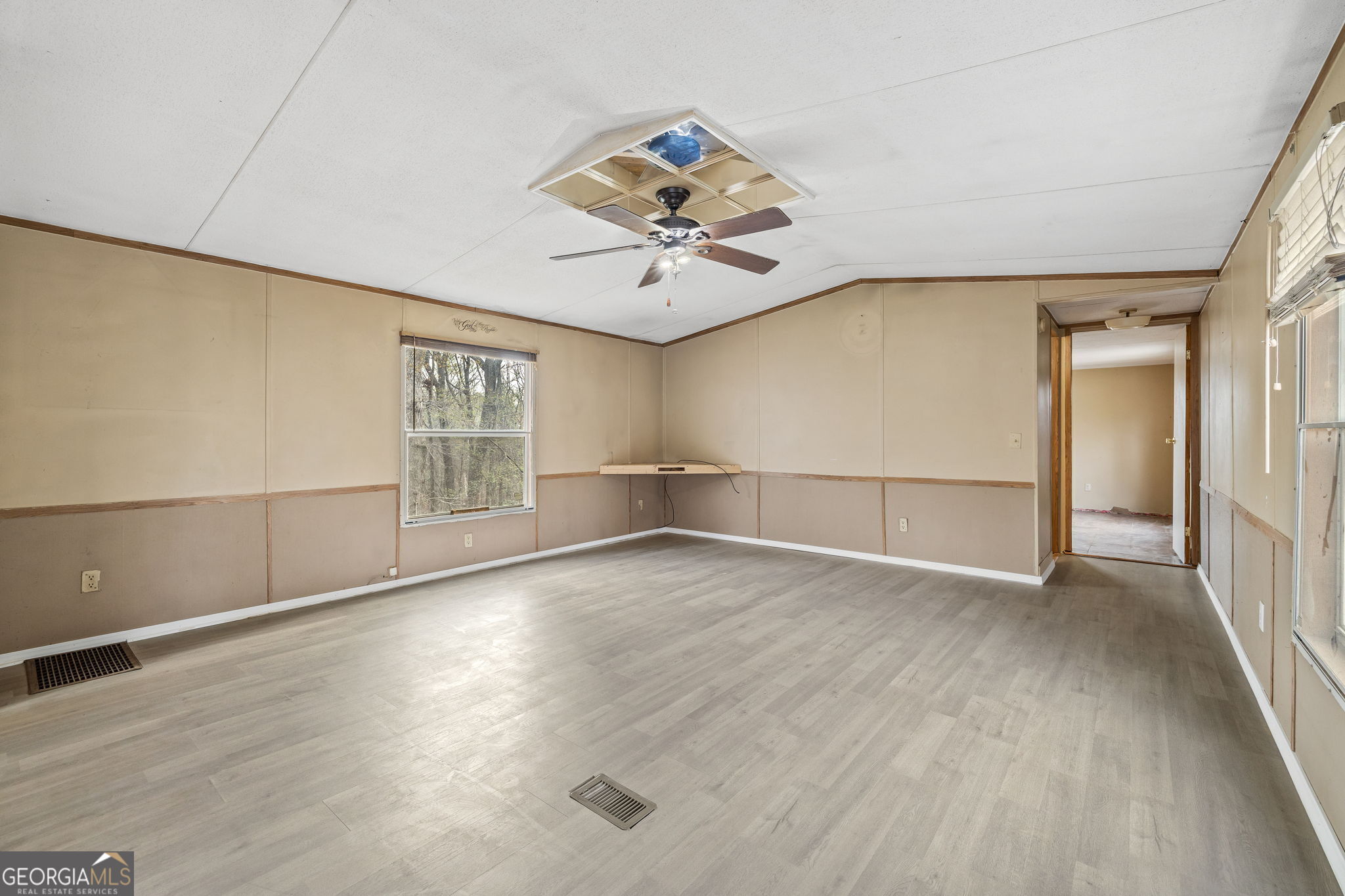 401 Otis Brown Road Baldwin, GA 30511 - Photo 3 of 23 wooden floor in an empty room with a window