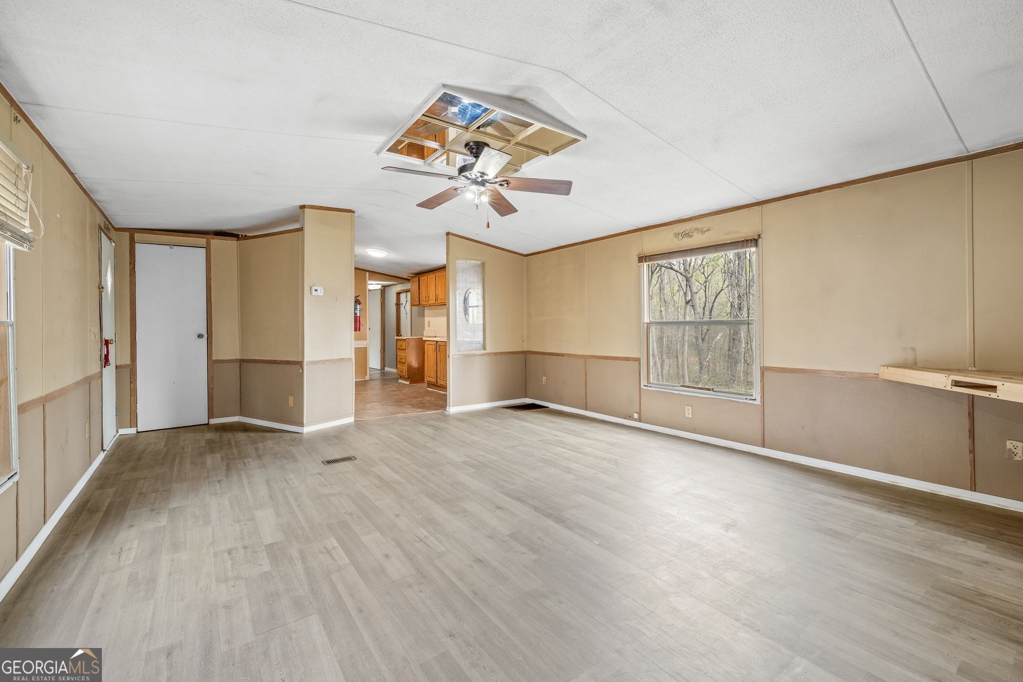 401 Otis Brown Road Baldwin, GA 30511 - Photo 4 of 23 wooden floor in an empty room with a window