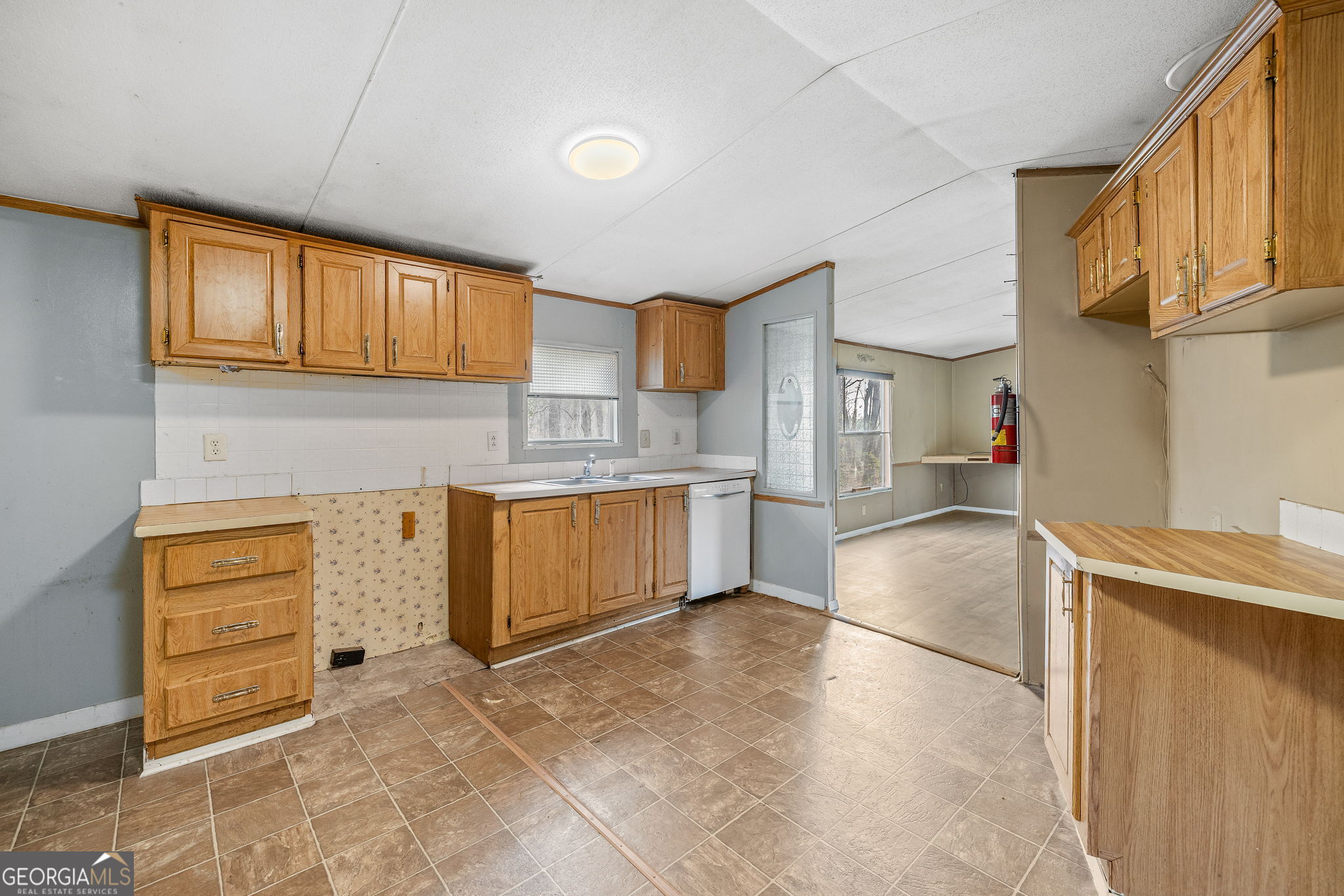 401 Otis Brown Road Baldwin, GA 30511 - Photo 8 of 23 a kitchen with stainless steel appliances granite countertop a stove and a refrigerator