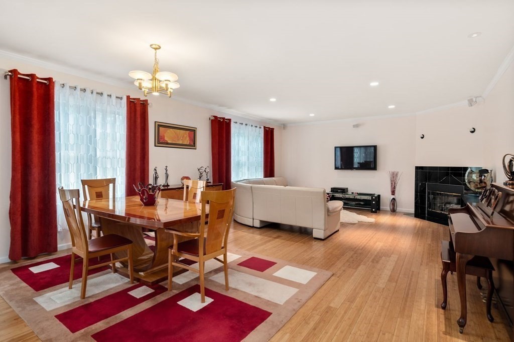 16 Ludwig Road, Unit 16 Needham, MA 02494 - Photo 8 of 33 a view of a dining room with furniture and a chandelier