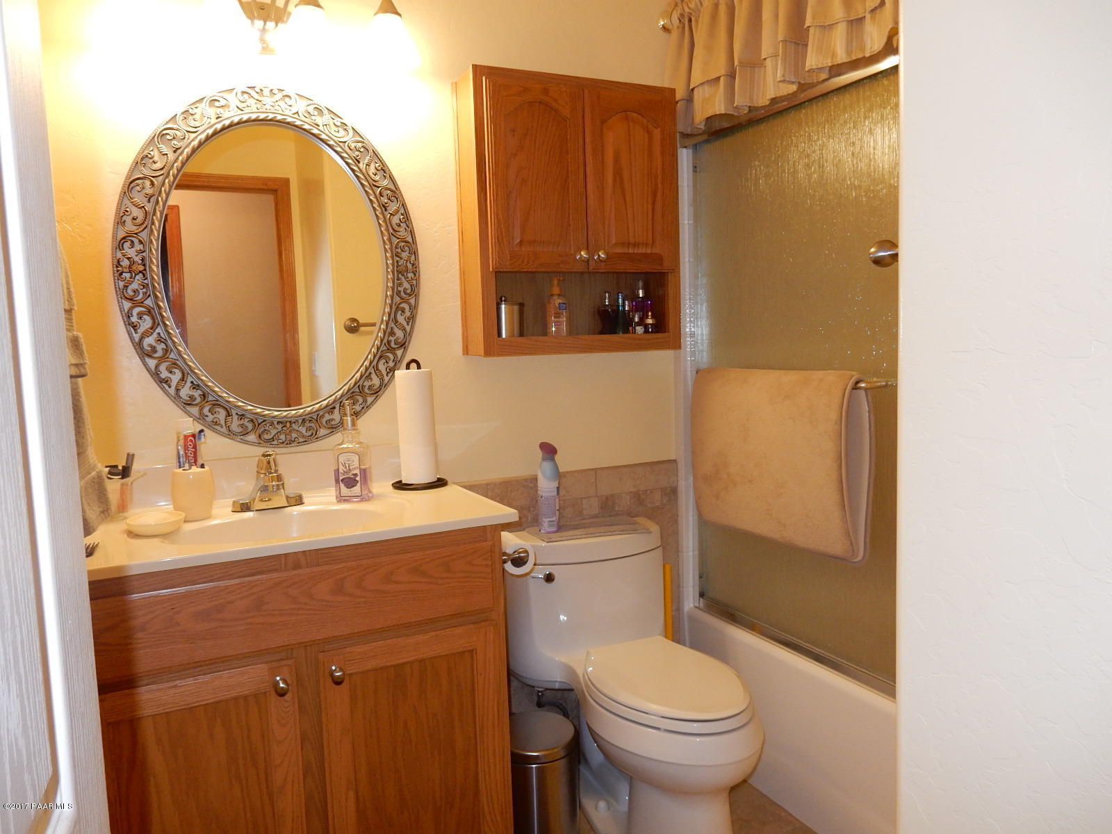 600 West Iris Road Paulden, AZ 86334 - Photo 15 of 39 a bathroom with a toilet sink and mirror