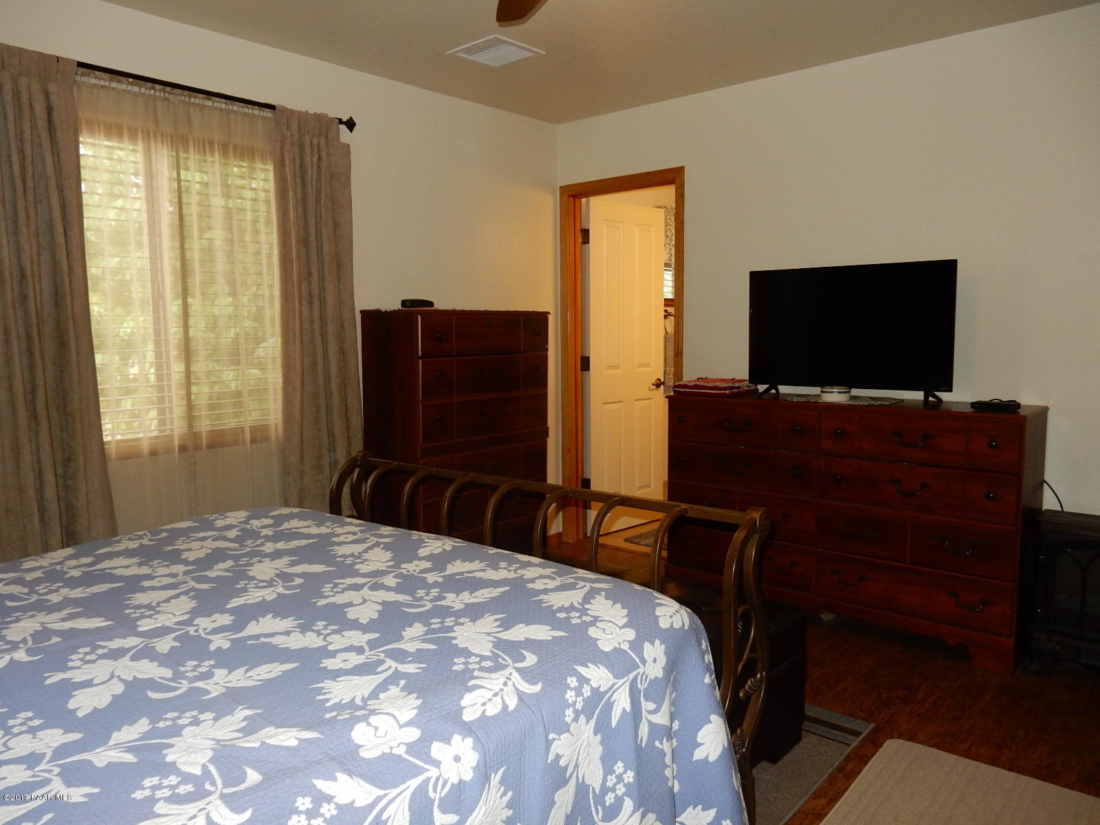 600 West Iris Road Paulden, AZ 86334 - Photo 17 of 39 a bedroom with a bed and a flat screen tv
