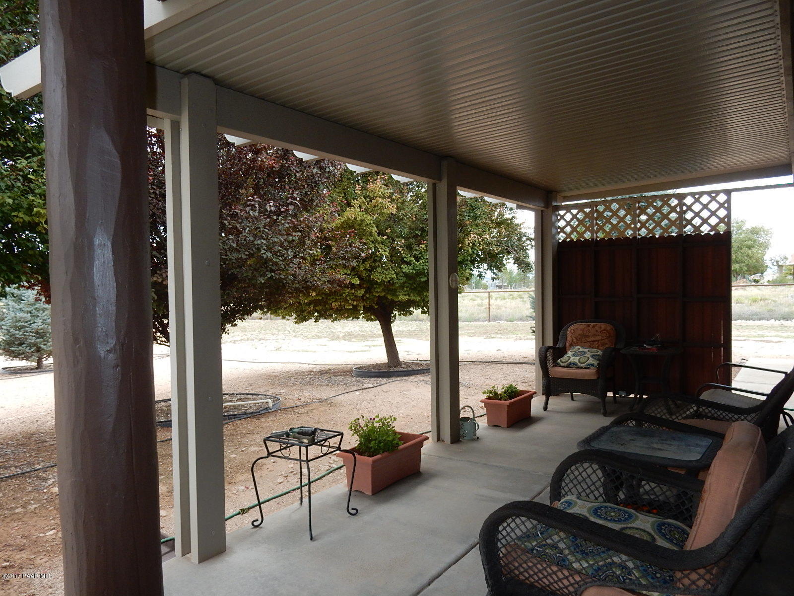 600 West Iris Road Paulden, AZ 86334 - Photo 4 of 39 a living room with patio furniture and a floor to ceiling window