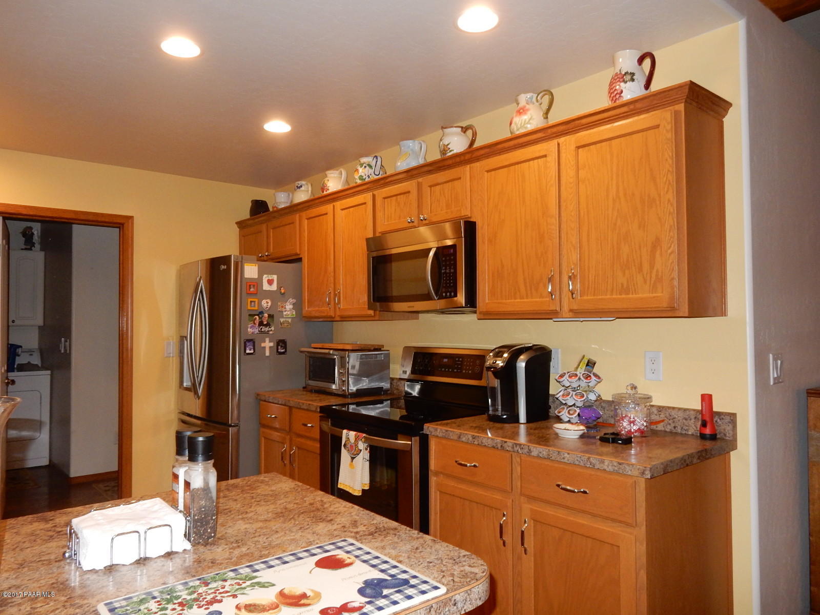 600 West Iris Road Paulden, AZ 86334 - Photo 10 of 39 a kitchen with stainless steel appliances a stove refrigerator sink and microwave