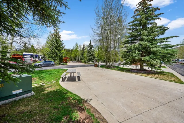 a view of a street with a building and a street sign