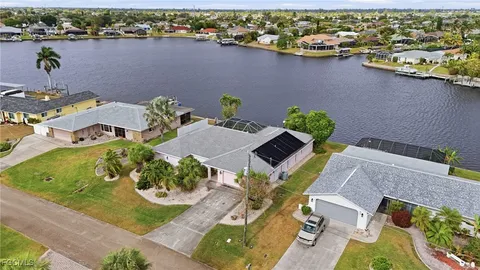 a view of a wooden chairs and table on the deck
