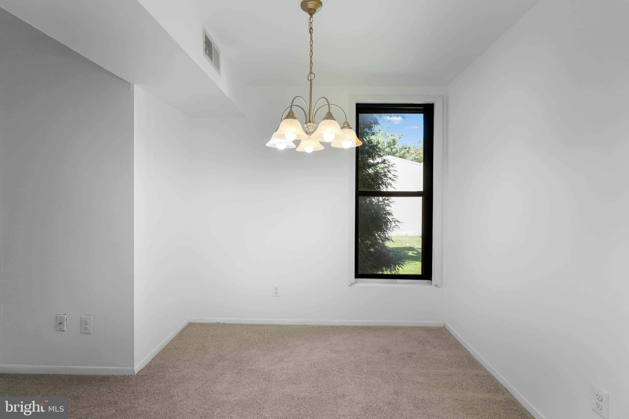 106 Duvall Lane, Unit 43 Gaithersburg, MD 20877 - Photo 11 of 38 an empty room with window