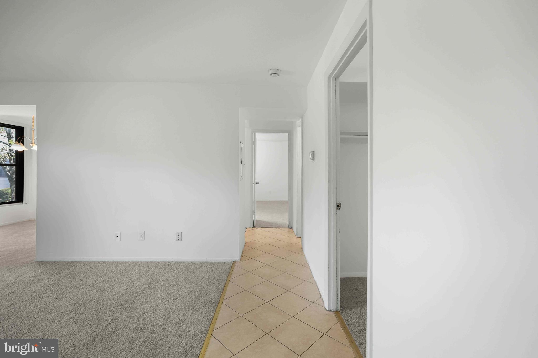 106 Duvall Lane, Unit 43 Gaithersburg, MD 20877 - Photo 16 of 38 a view of a hallway with wooden floor and entryway