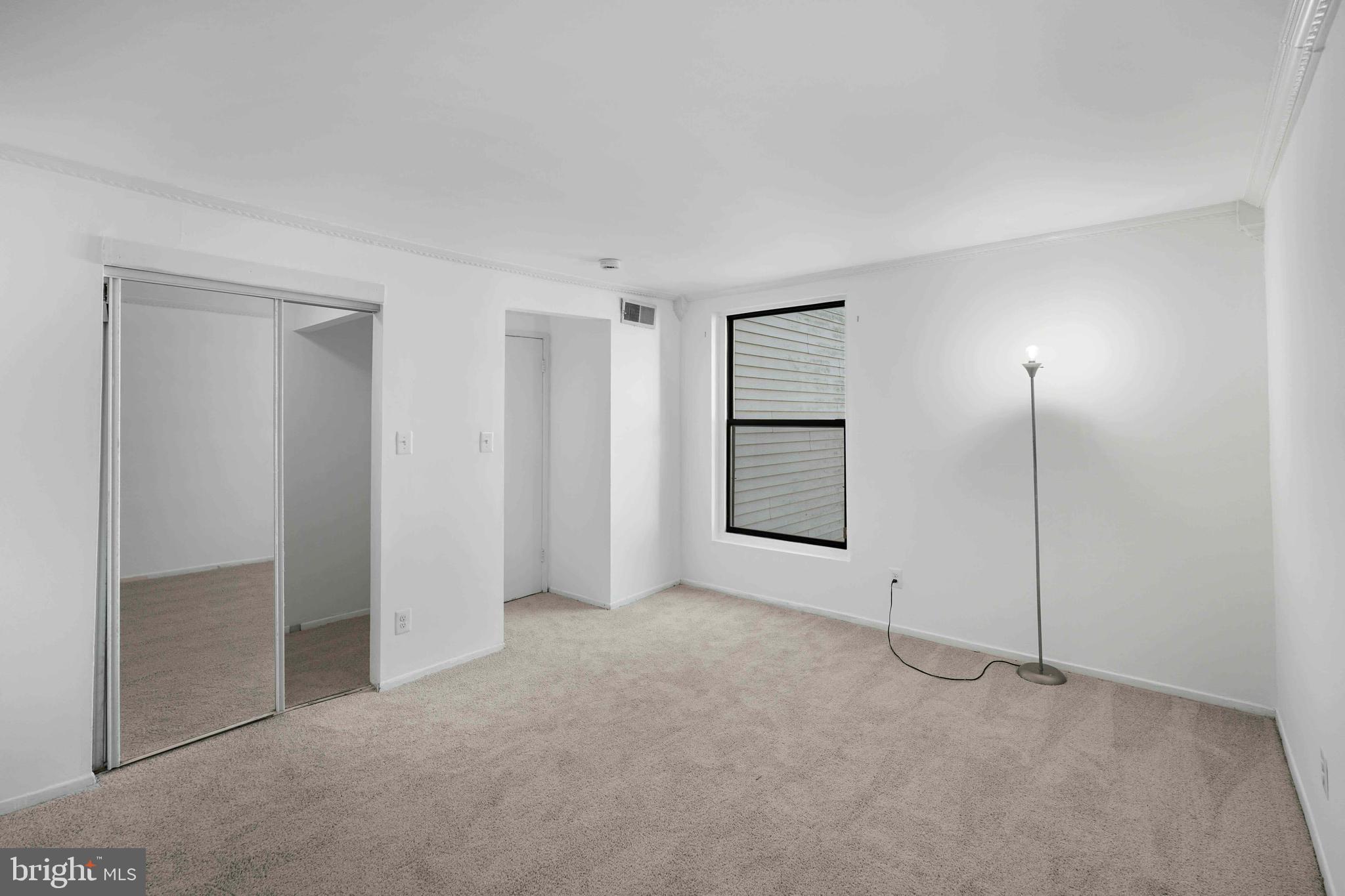 106 Duvall Lane, Unit 43 Gaithersburg, MD 20877 - Photo 17 of 38 an empty room with windows and closet