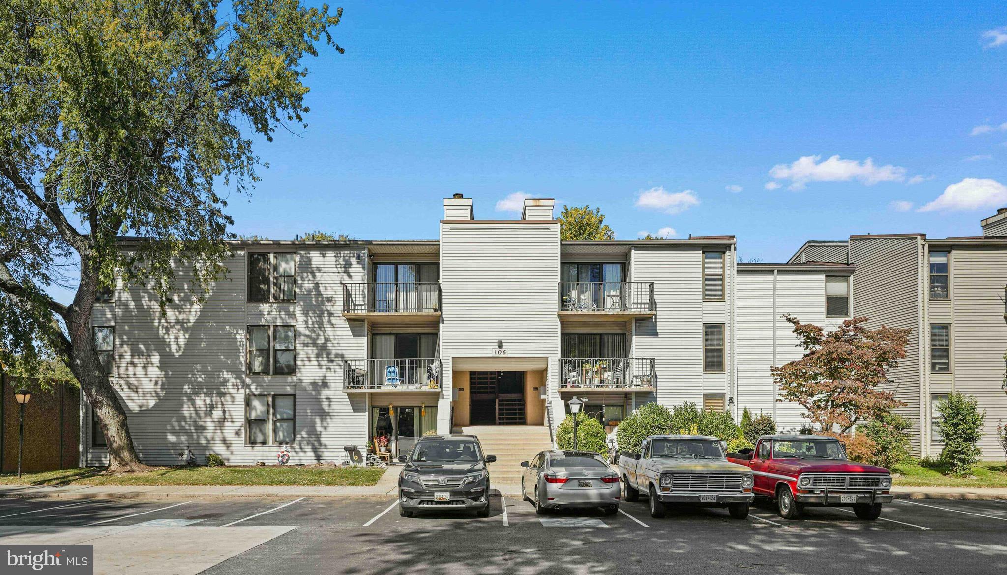 106 Duvall Lane, Unit 43 Gaithersburg, MD 20877 - Photo 2 of 38 a couple of cars parked in front of a building