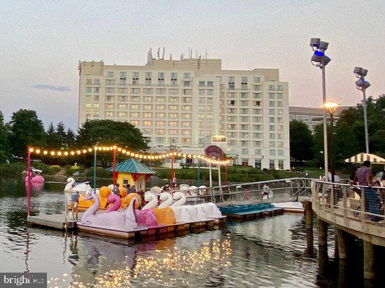 106 Duvall Lane, Unit 43 Gaithersburg, MD 20877 - Photo 32 of 38 a view of ocean with boats and palm trees