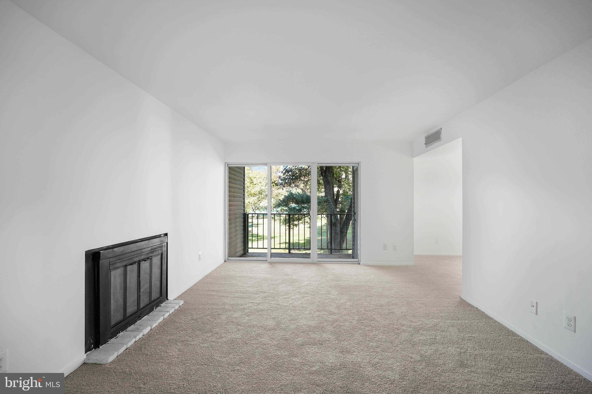 106 Duvall Lane, Unit 43 Gaithersburg, MD 20877 - Photo 4 of 38 a view of an empty room with a window