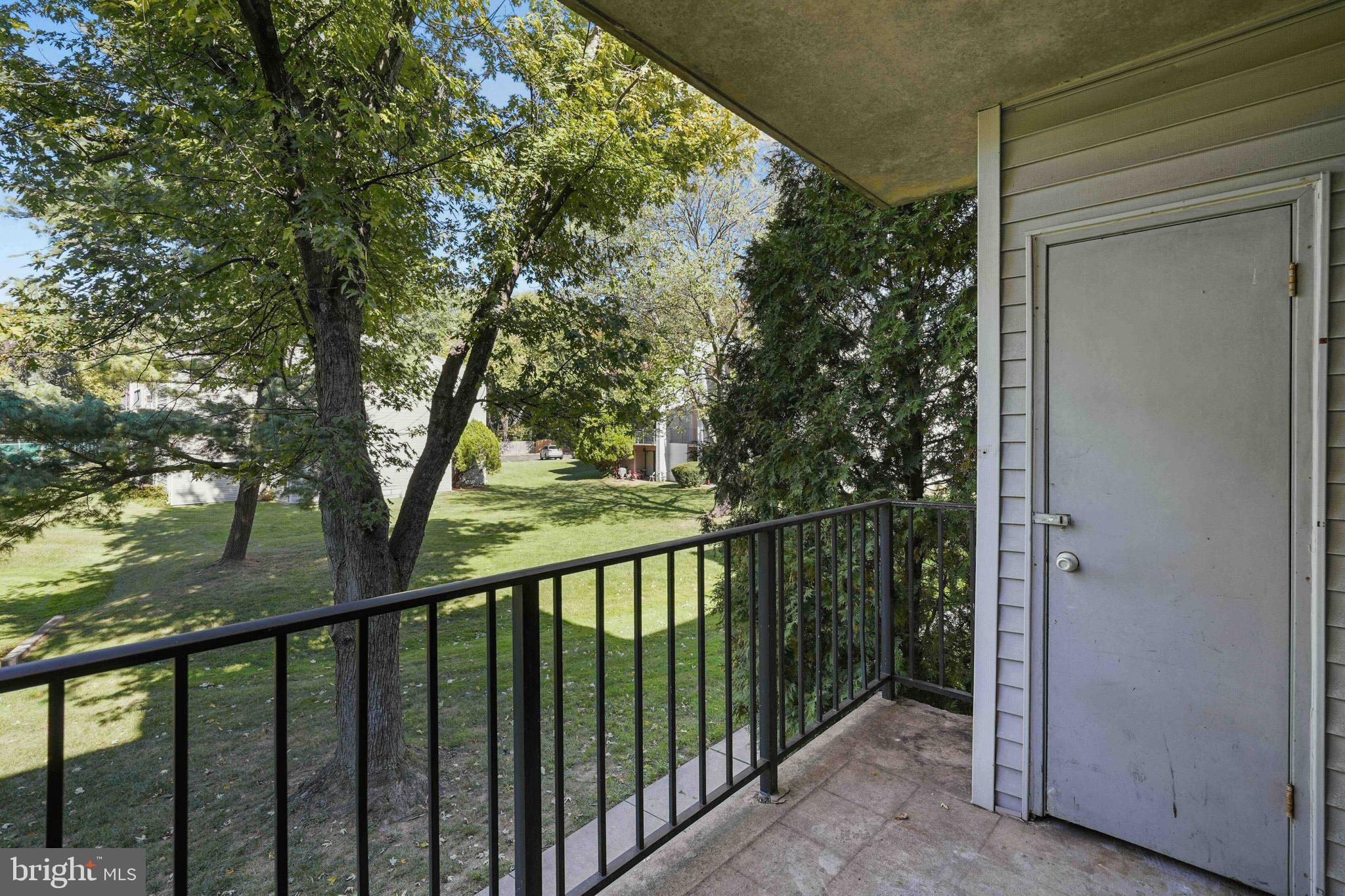106 Duvall Lane, Unit 43 Gaithersburg, MD 20877 - Photo 7 of 38 a view of a balcony with wooden floor