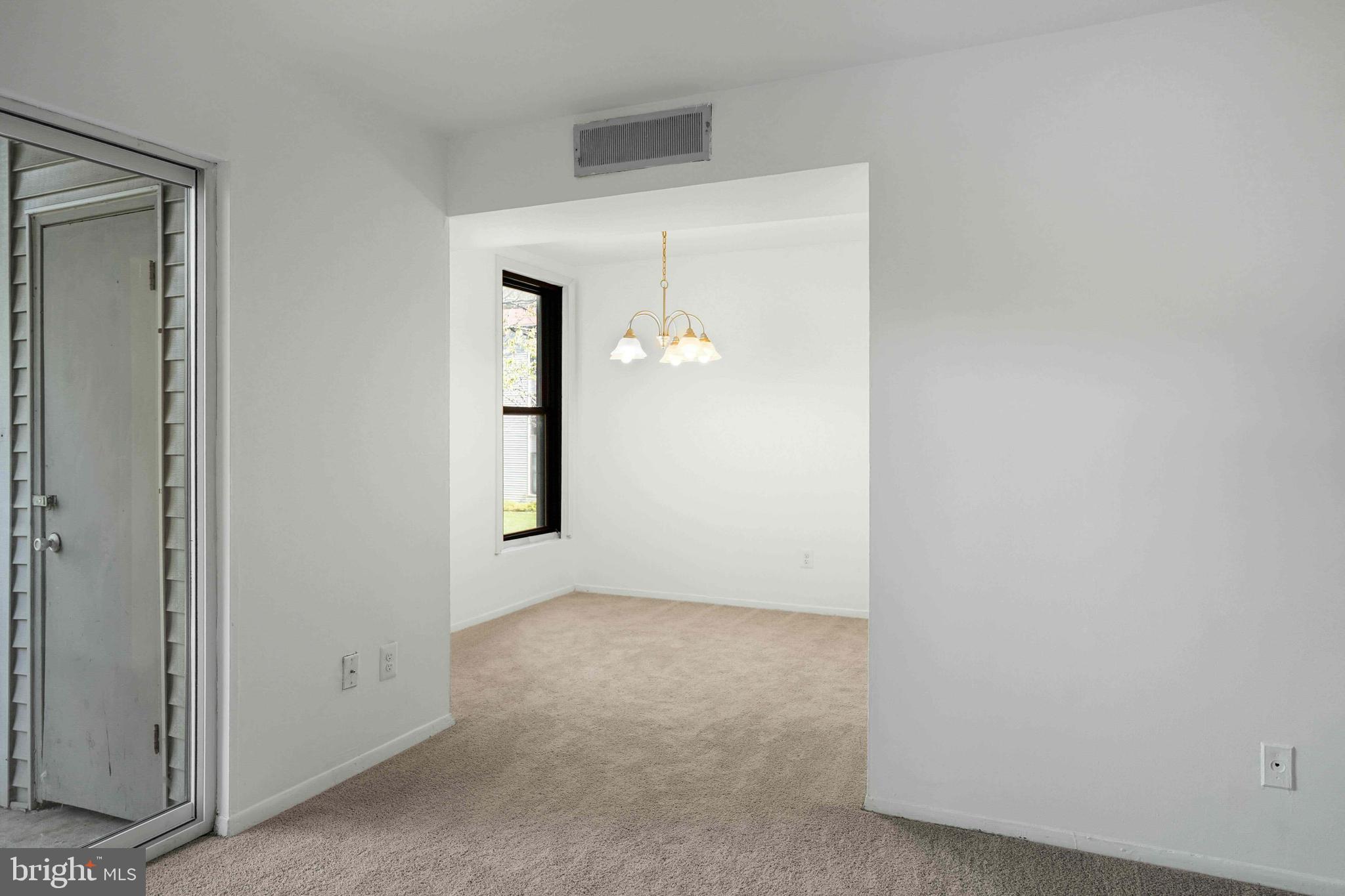 106 Duvall Lane, Unit 43 Gaithersburg, MD 20877 - Photo 10 of 38 an empty room with windows and closet