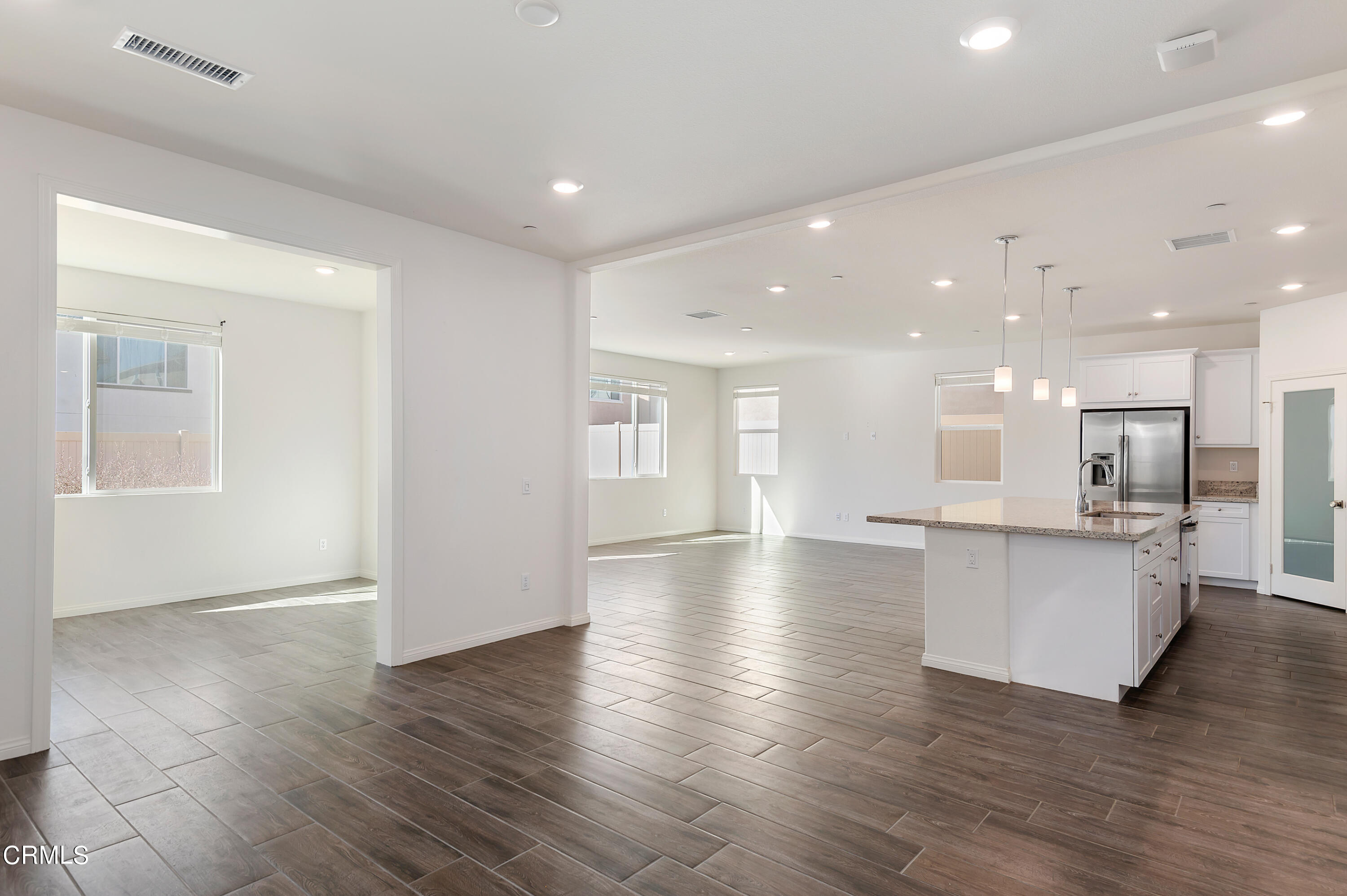438 Lisbon Place Santa Paula, CA 93060 - Photo 4 of 24 a view of kitchen with cabinets and wooden floor